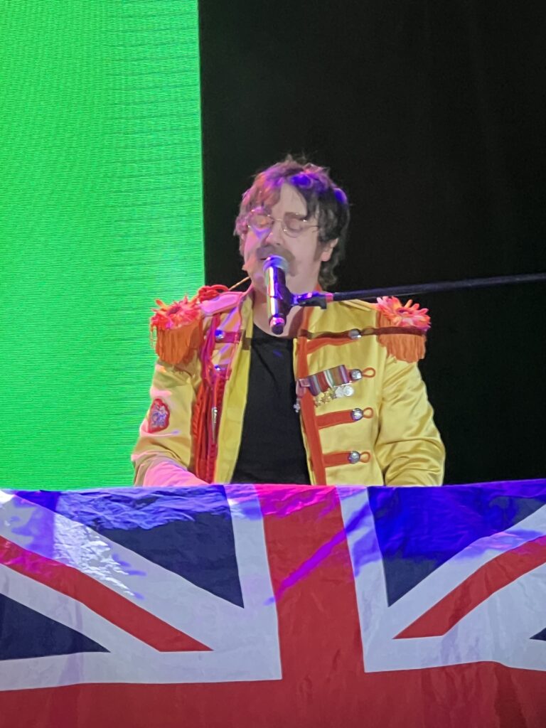 John singing All You Need Is Love from the keyboards